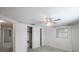 Bedroom with ceiling fan and mirrored closet doors at 1069 Rushmore Dr, Holiday, FL 34690