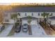 Aerial view of townhomes showing a well-maintained exterior, landscaping, and ample parking at 12827 Buffalo Run Dr, Gibsonton, FL 33534