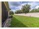 Spacious backyard with lush green grass and a well-maintained fence, great for outdoor activities at 12827 Buffalo Run Dr, Gibsonton, FL 33534