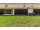 Expansive yard with green lawn and enclosed patios at 12827 Buffalo Run Dr, Gibsonton, FL 33534