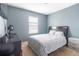 Comfortable bedroom with a large window allowing natural light and cozy carpeting at 12827 Buffalo Run Dr, Gibsonton, FL 33534