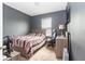 A cozy bedroom featuring carpeted floors, a window for natural light, and a comfortable atmosphere at 12827 Buffalo Run Dr, Gibsonton, FL 33534