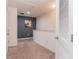 Upstairs hallway with neutral carpet and white doors leading to various rooms at 12827 Buffalo Run Dr, Gibsonton, FL 33534