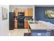 Functional kitchen featuring stainless steel appliances, ample counter space, and an open layout at 12827 Buffalo Run Dr, Gibsonton, FL 33534