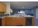 Open concept kitchen view to the living room with modern appliances and stylish backsplash at 12827 Buffalo Run Dr, Gibsonton, FL 33534