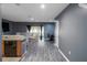 Open-concept living room with modern flooring and a sliding glass door leading to a patio at 12827 Buffalo Run Dr, Gibsonton, FL 33534