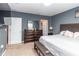 Comfortable main bedroom with a dresser, tv, and a relaxing atmosphere at 12827 Buffalo Run Dr, Gibsonton, FL 33534