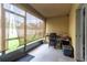 Screened in patio with grill and bicycle at 12827 Buffalo Run Dr, Gibsonton, FL 33534