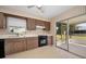 Kitchen with sliding glass doors to patio at 1518 W Dorchester Dr, Palm Harbor, FL 34684