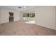 Living room with view of kitchen and patio at 1518 W Dorchester Dr, Palm Harbor, FL 34684