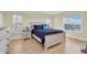 Cozy bedroom with a full-size bed and ample natural light at 19029 Us Highway 19 N # 8-25, Clearwater, FL 33764