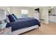 Main bedroom with a comfortable bed and view of the outdoors at 19029 Us Highway 19 N # 8-25, Clearwater, FL 33764