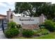 Imperial Cove community entrance with landscaped grounds at 19029 Us Highway 19 N # 8-25, Clearwater, FL 33764