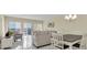 Open concept dining area with seating for four and living room view at 19029 Us Highway 19 N # 8-25, Clearwater, FL 33764