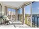Relaxing sunroom boasting water views and ample natural light at 19029 Us Highway 19 N # 8-25, Clearwater, FL 33764
