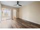 Bedroom with sliding glass doors to lanai and en-suite bathroom at 2002 Australia E Way # 66, Clearwater, FL 33763