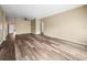 Spacious living room with wood-look floors and neutral walls at 2002 Australia E Way # 66, Clearwater, FL 33763