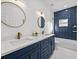 Elegant bathroom with navy blue vanity and double sinks at 208 W Alfred St, Tampa, FL 33603