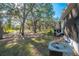 Private backyard with mature trees and AC unit at 2432 Lake Woodberry Cir # 2432, Brandon, FL 33510