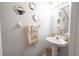 Small half bathroom with pedestal sink and decorative mirrors at 2432 Lake Woodberry Cir # 2432, Brandon, FL 33510