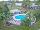 Community pool with plenty of lounge chairs and gazebo at 2432 Lake Woodberry Cir # 2432, Brandon, FL 33510