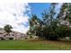 Building exterior surrounded by lush landscaping at 2436 Rhodesian Dr # 32, Clearwater, FL 33763