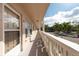 Building hallway with white railings and light-beige walls at 2436 Rhodesian Dr # 32, Clearwater, FL 33763