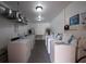 Well-lit laundry room with several washers and dryers at 2436 Rhodesian Dr # 32, Clearwater, FL 33763