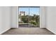 Bright bedroom with balcony access and city view at 2611 Bayshore Blvd # 506, Tampa, FL 33629