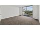 Spacious bedroom with carpet and sliding glass door at 2611 Bayshore Blvd # 506, Tampa, FL 33629