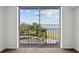 Bedroom with water views and sliding door access to balcony at 2611 Bayshore Blvd # 506, Tampa, FL 33629