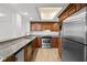 Modern kitchen with stainless steel appliances and wood cabinets at 2611 Bayshore Blvd # 506, Tampa, FL 33629