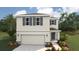 Two-story house with gray siding, gray shutters, and a two-car garage at 3443 Hilltop Cir, Lakewood Ranch, FL 34211