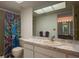 Bright bathroom with vanity, toilet and shower/tub combo at 3743 Teeside Dr, New Port Richey, FL 34655