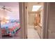 Bedroom with bathroom access and a floral comforter at 3743 Teeside Dr, New Port Richey, FL 34655
