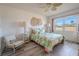 Bedroom with leafy bedding, wood-look floors and large window at 3743 Teeside Dr, New Port Richey, FL 34655
