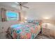 Spacious bedroom with floral bedding and nightstands at 3743 Teeside Dr, New Port Richey, FL 34655