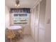 Bright dining area with round table and chairs, built-in shelving at 3743 Teeside Dr, New Port Richey, FL 34655