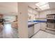 Efficient kitchen features stainless steel appliances and a blue countertop at 3743 Teeside Dr, New Port Richey, FL 34655