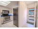 Kitchen entry with stainless steel appliances and view of the outdoors at 3743 Teeside Dr, New Port Richey, FL 34655