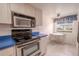 Kitchen with stainless steel appliances and blue countertops at 3743 Teeside Dr, New Port Richey, FL 34655