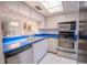 Kitchen with stainless steel appliances and blue countertops at 3743 Teeside Dr, New Port Richey, FL 34655