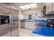 Kitchen with stainless steel appliances and blue countertops at 3743 Teeside Dr, New Port Richey, FL 34655