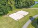 Recreational sand volleyball court with benches for spectators at 3743 Teeside Dr, New Port Richey, FL 34655