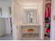 Vanity area with lighted mirror and adjacent closet at 3743 Teeside Dr, New Port Richey, FL 34655