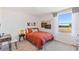 Cozy bedroom with a full-size bed and window seat at 5253 Salt Marsh Rd, Wimauma, FL 33598