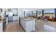 Open concept kitchen with island and stainless steel appliances at 5253 Salt Marsh Rd, Wimauma, FL 33598