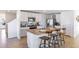 Modern kitchen with granite countertops and white cabinets at 5253 Salt Marsh Rd, Wimauma, FL 33598