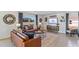 Living room featuring a large TV and comfortable seating at 5253 Salt Marsh Rd, Wimauma, FL 33598