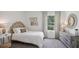 Bright bedroom with a full bed and stylish decor at 5259 Salt Marsh Rd, Wimauma, FL 33598
